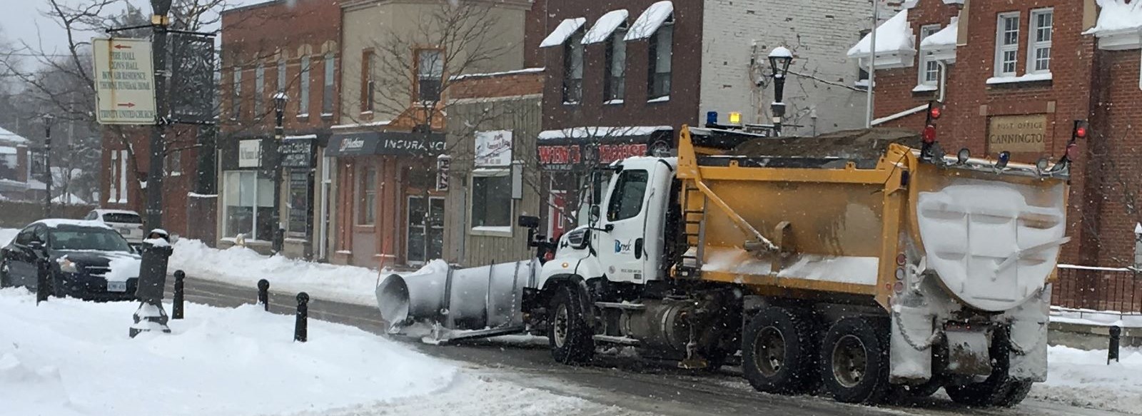snow plow clearing snow from streets