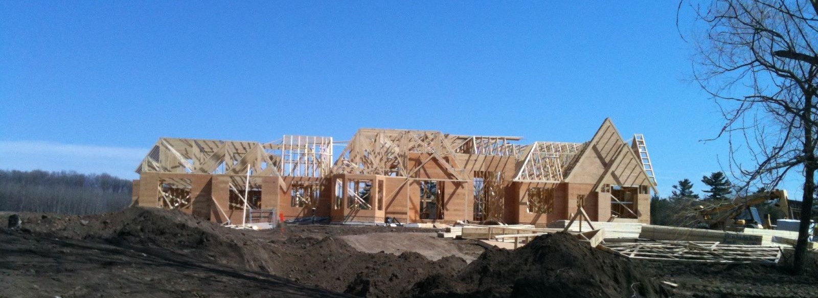 a house in the process of being built - framing of the house completed