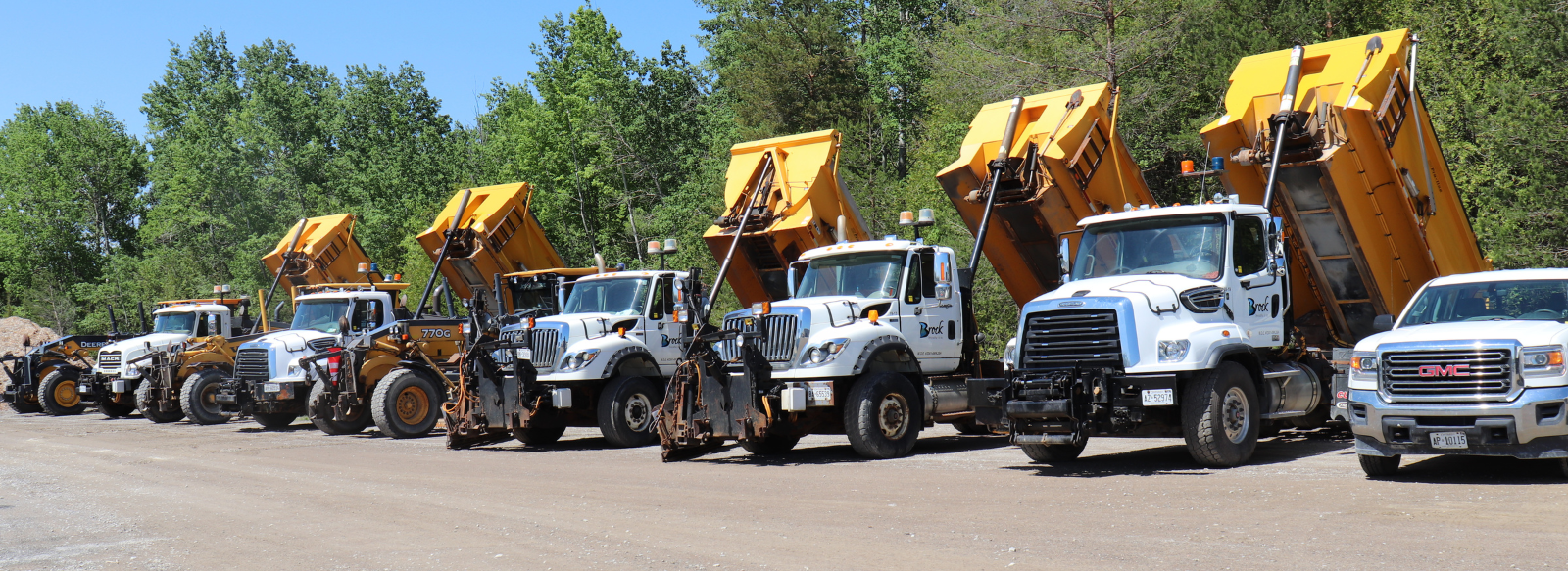 municipal dump trucks lined up