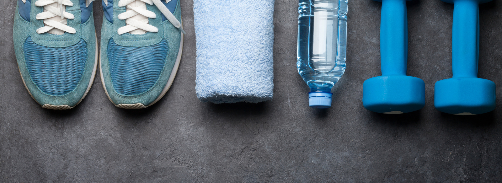 blue running shoes, towel and weights, water bottle